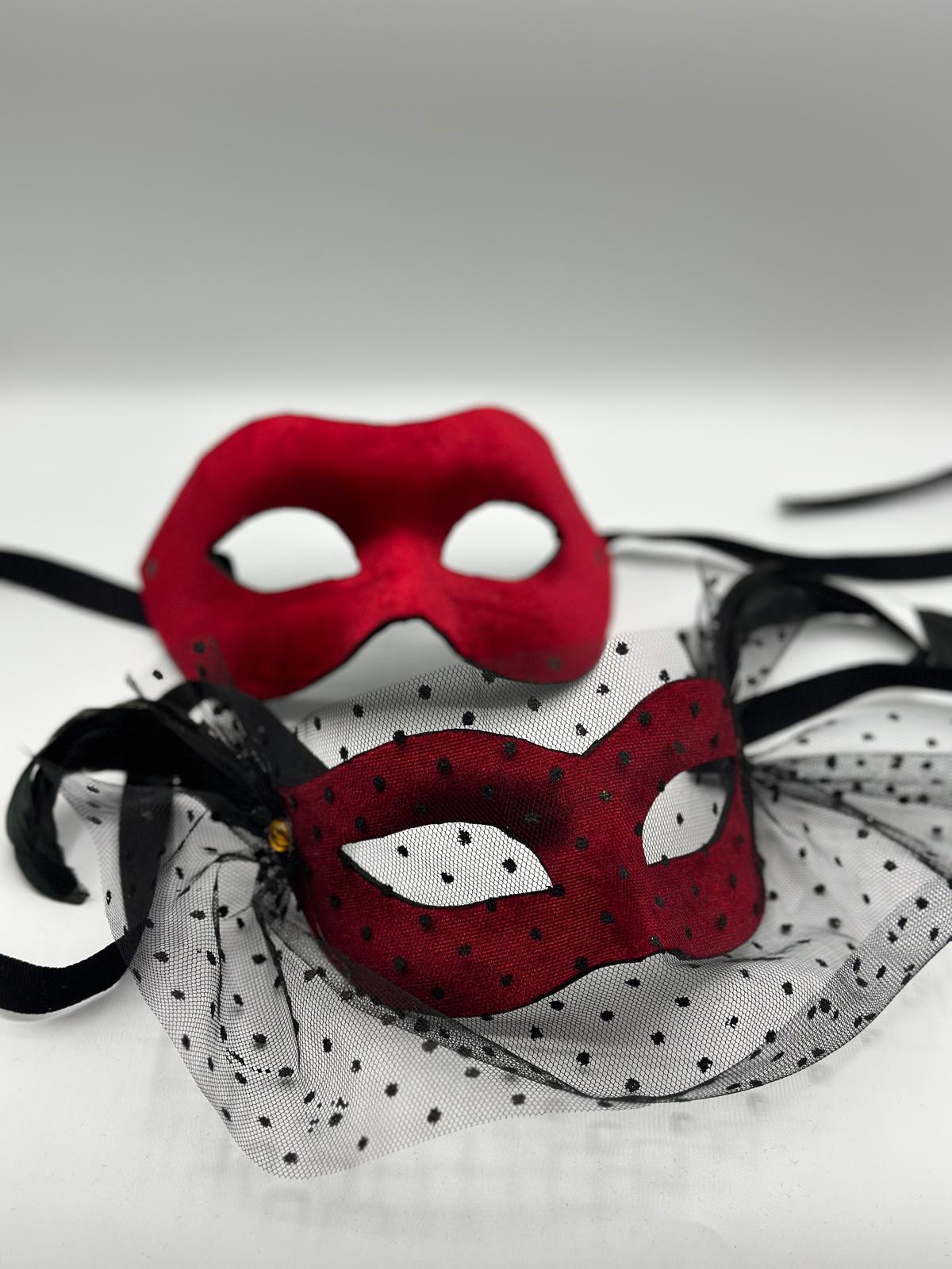 Two Venetian ball masks - man and woman mask - in red velvet. Couple mask red